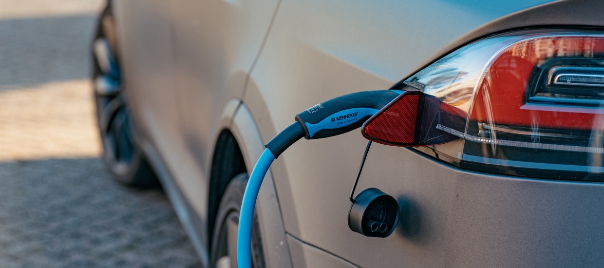 Electric vehicle being charged at a home