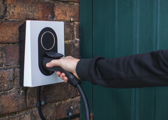 Person holding an EV charger